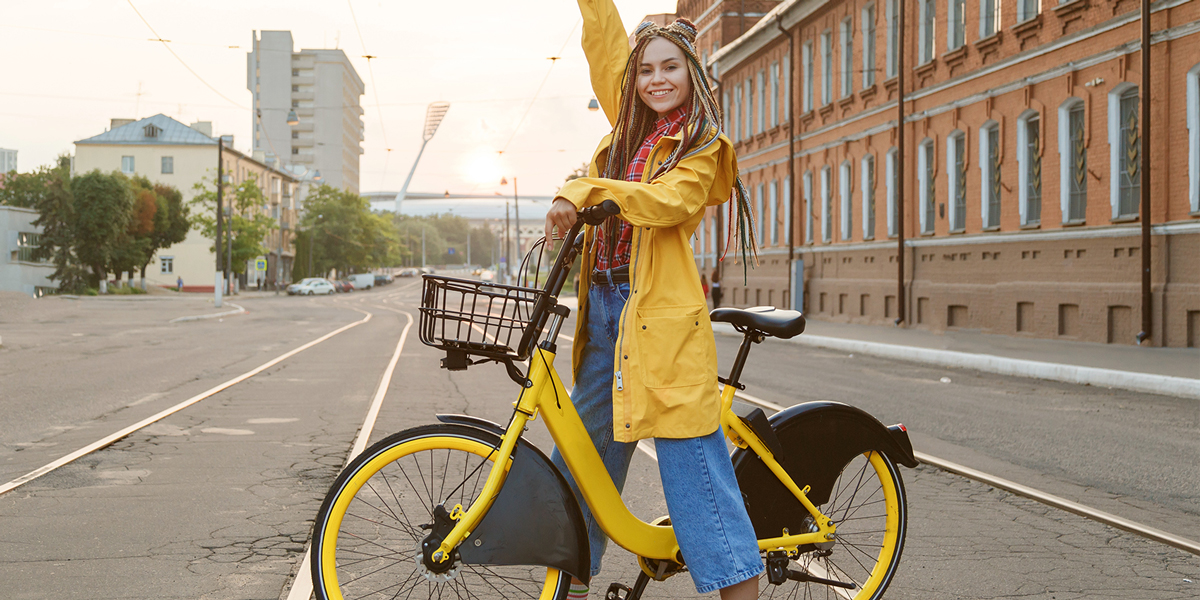 A woman improving her depression while riding a yellow bike